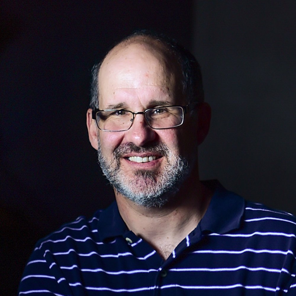 Person wearing glasses smiling
