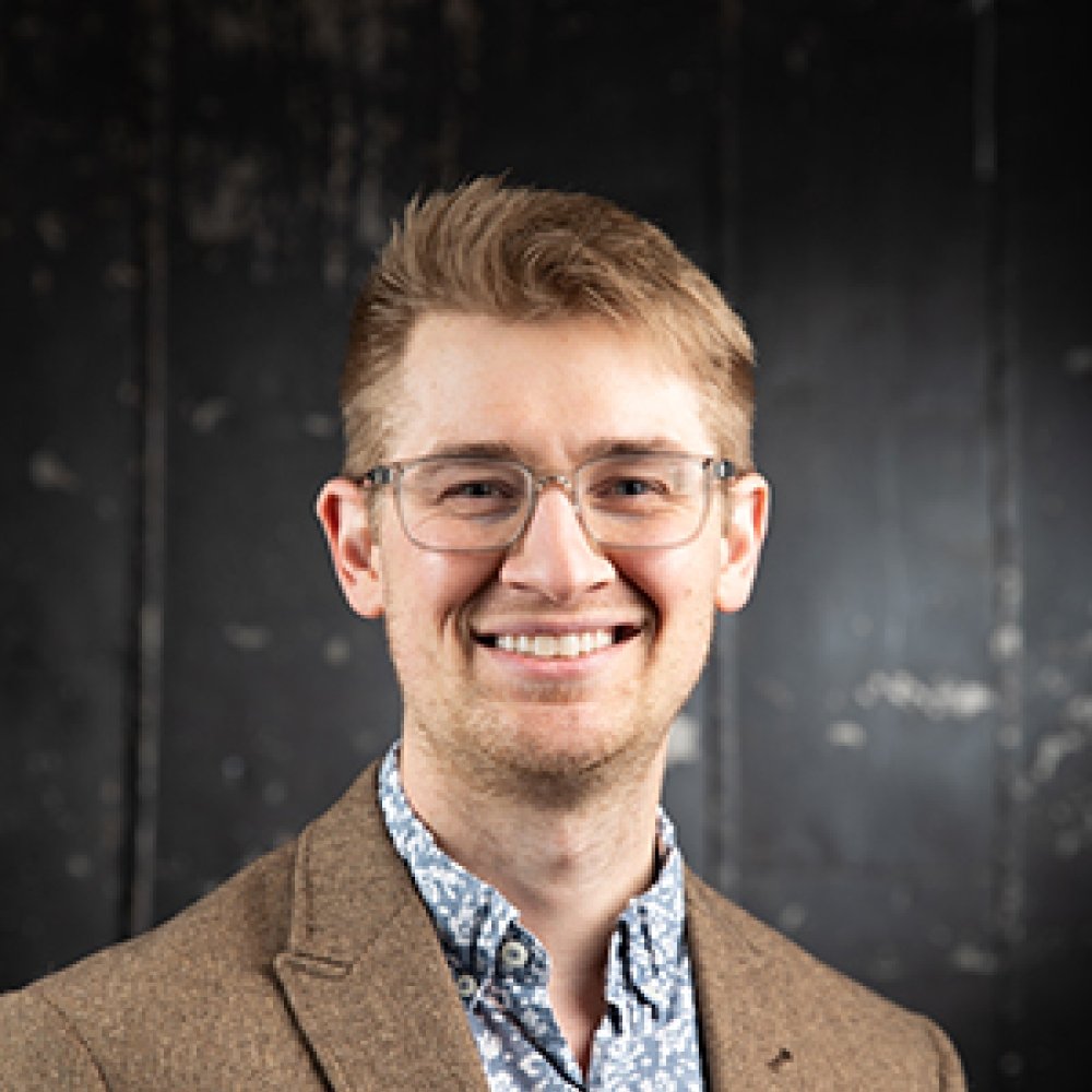 Person wearing glasses smiling