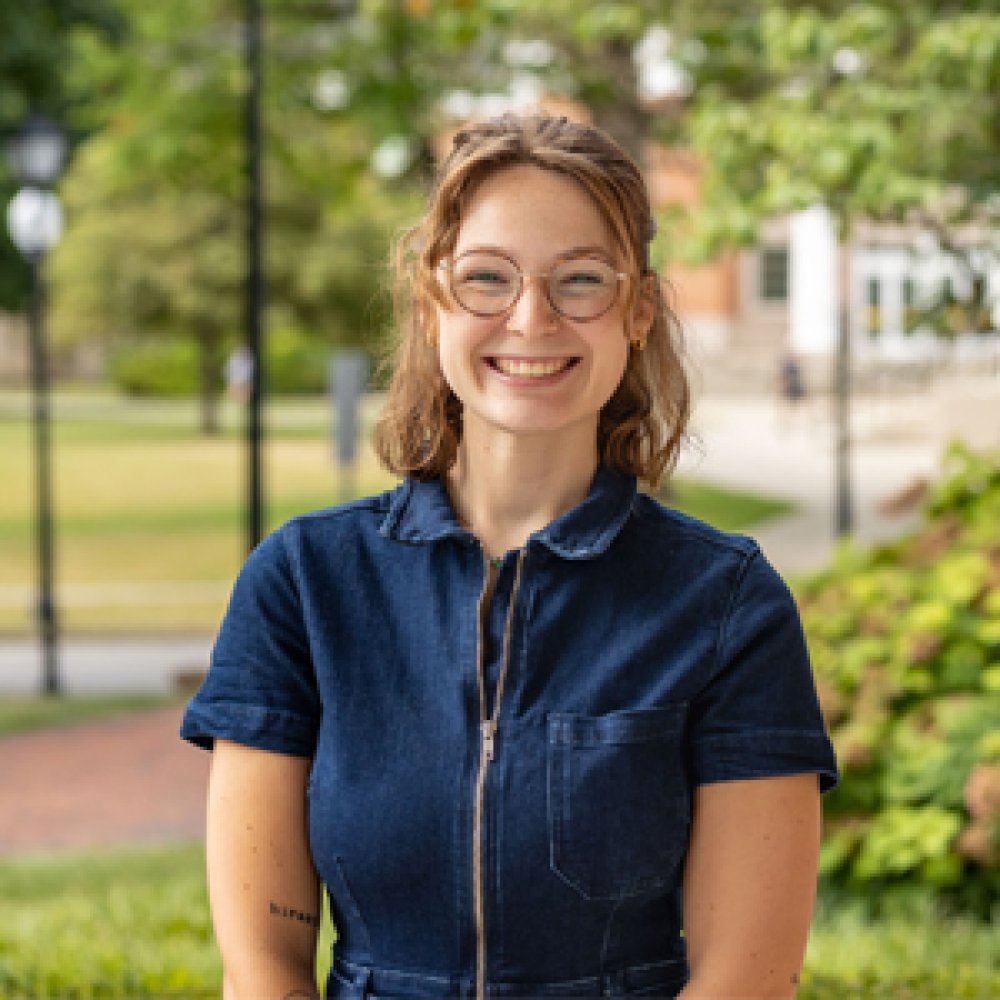 Person wearing glasses and smiling