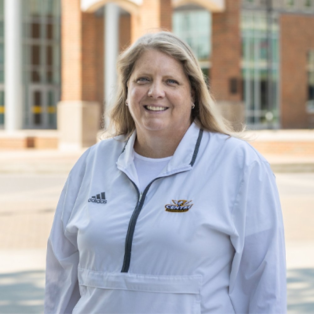 Person wearing Centre College swimming and diving pull over and smiling at camera