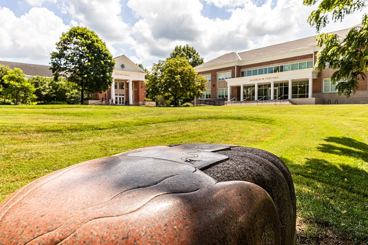 Palace of Memories statue with Young and Olin buildings in the background