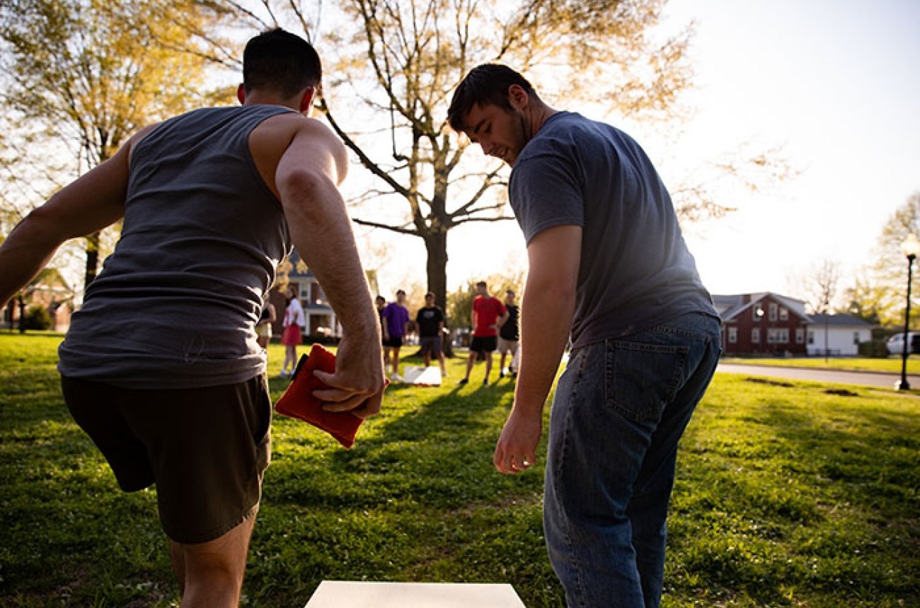 Students enjoying a lawn game on campus