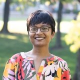 Person wearing glasses smiling