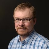 Person wearing glasses smiling