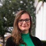 Person wearing glasses and smiling