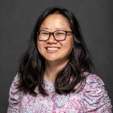 Person wearing glasses and smiling