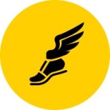Gold circle with running shoe with wings icon in black