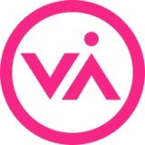 Pink circle with a V and upside down V with a dot over the upside down V