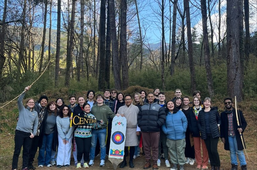 Students participate in a traditional archery session in Bhutan