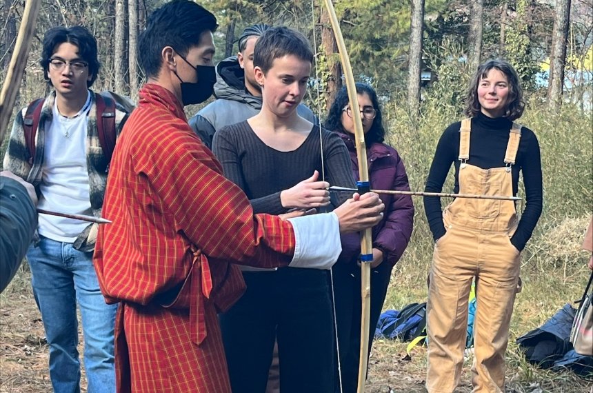 Students participate in a traditional archery session in Bhutan