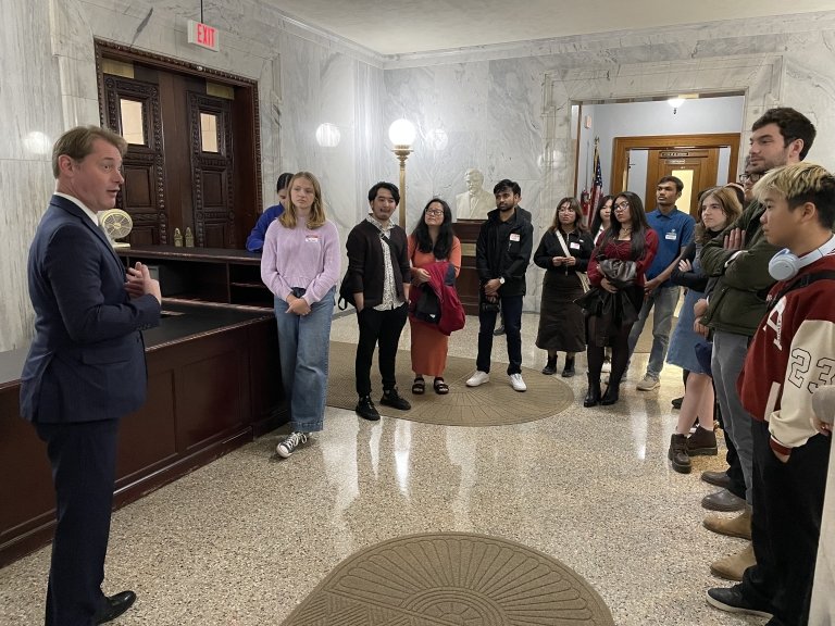 The Office of Civic and Community Engagement brought students to the Kentucky state capitol for an alternate fall break trip. Pictured with Secretary of State Michael Adams.