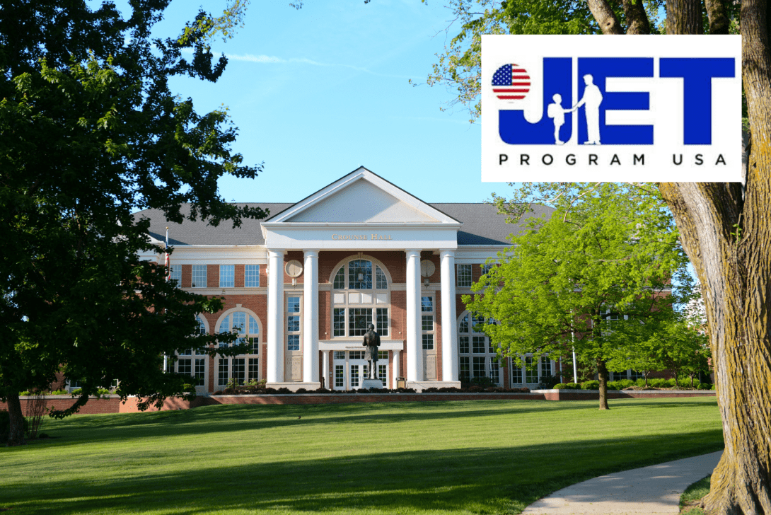 A beautiful photo of Crounse Hall on a spring day with the JET Program USA logo superimposed.